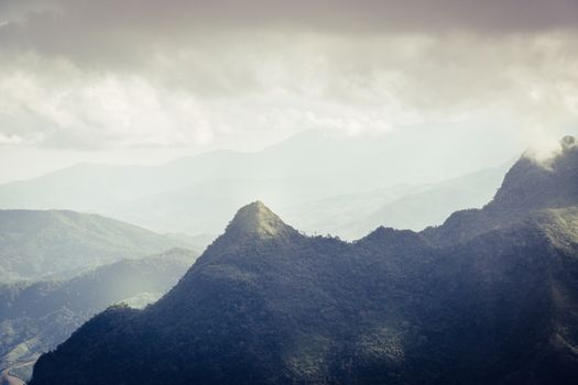 Overlapping mountains and rain clouds