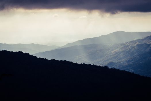 Overlapping mountains and rain clouds