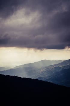 Overlapping mountains and rain clouds