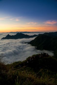 sunrise and sea of fog view on phu chi fa mountain area and national forest park in chiang rai, Thailand.