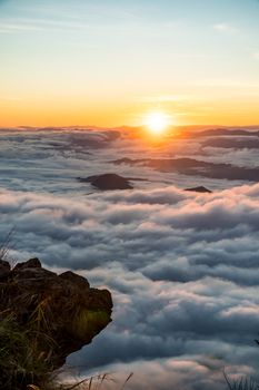 sunrise and sea of fog view on phu chi fa mountain area and national forest park in chiang rai, Thailand.