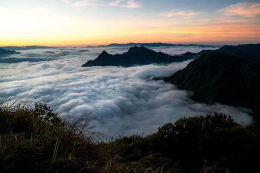 sunrise and sea of fog view on phu chi fa mountain area and national forest park in chiang rai, Thailand.