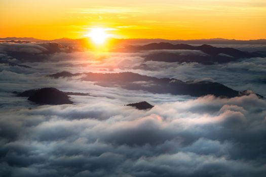 sunrise and sea of fog view on phu chi fa mountain area and national forest park in chiang rai, Thailand.