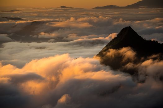 sunrise and sea of fog view on phu chi fa mountain area and national forest park in chiang rai, Thailand.