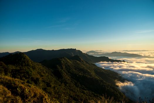 sunrise and sea of fog view on phu chi fa mountain area and national forest park in chiang rai, Thailand.