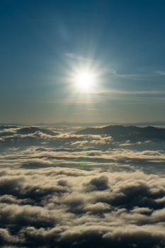 sunrise and sea of fog view on phu chi fa mountain area and national forest park in chiang rai, Thailand.