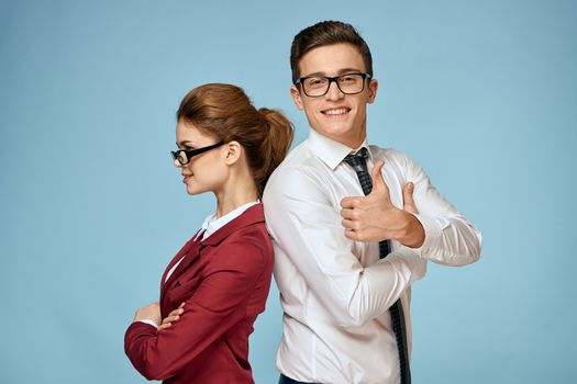 Business young couple officials office team office blue background. High quality photo