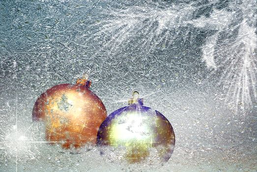 Golden christmas balls on the icy background. Winter poster with copy space. Christmas bauble before a twinkle holiday backdrop. Merry christmas card. New year banner
