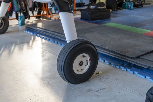 wheels of a parachute plane stopped in storage