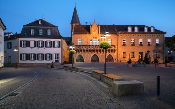 Panoramic image of the market square of Bad Sobernheim with townhall and old pharmacy at blue hour, Germany 