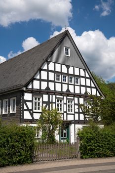 Image of an old half-timbered house against sky in summertime, Oberkirchen, Schmallenberg, Sauerland, Germany