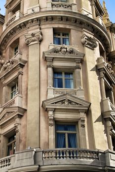 Old colorful and beautiful facades with vintage streetlight in Madrid streets in Spring.