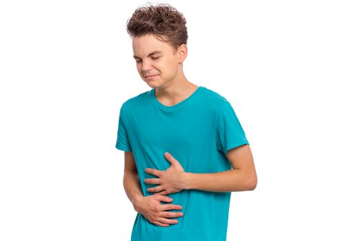 Upset unhappy young man holding his abdomen with both hands, suffering from bellyache, isolated on white background