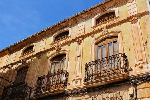 Colorful and majestic old house facade in Caravaca de La Cruz, Murcia, Spain in a sunny day of Spring