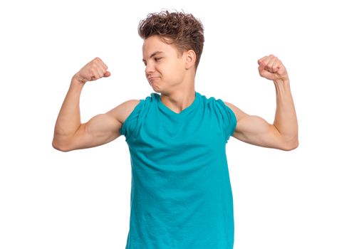 Handsome teen boy raised his hands and shows biceps, isolated on white background
