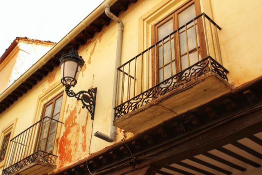 Old majestic facade and streetlight in a small village of Castilla La Mancha community, Spain. Alcaraz.