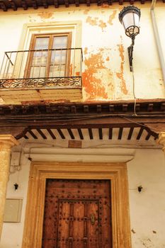 Old majestic facade and streetlight in a small village of Castilla La Mancha community, Spain. Alcaraz.