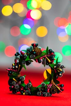 Colorful decorated Christmas wreaths isolated on background of blurred lights.