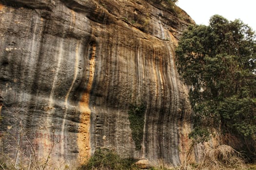 Mountain wall with colorful streaks in the Sierra of Alcaraz, Castile-la Mancha community, Spain