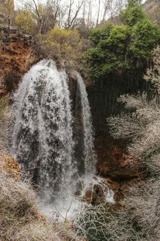 Waterfall called El Salto del Caballo and Alcaraz river crossing the natural site of Los Batanes, Alcaraz, Albacete, Spain