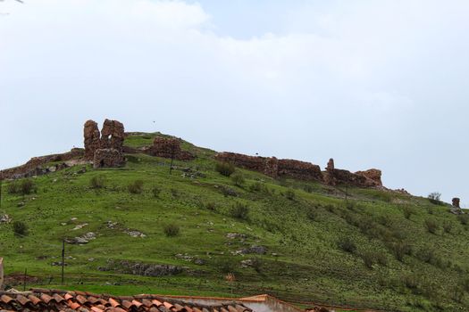 Old castle ruins in the mountain of Alcaraz in a cloudy day of spring. Alcaraz, Albacete, Spain.