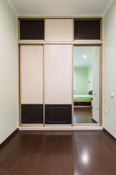 Close-up wardrobe in the interior of the bedroom