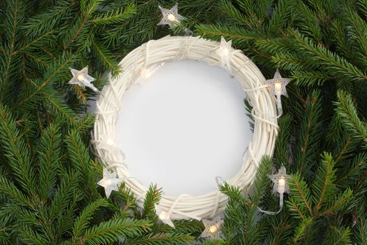 Christmas background with wreath and fir tree branches and white background copy space for text border frame for text