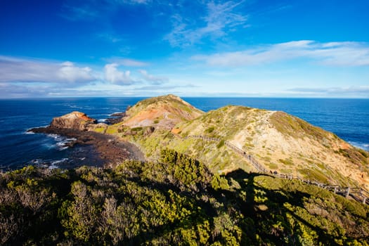 The famous Cape Schanck boardwalk runs towards the sea and rock formation known as London Bridge, in Victora. Australia