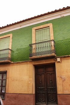 Colorful and majestic old house facade in Villanueva de los Infantes, Spain in a sunny day of Spring