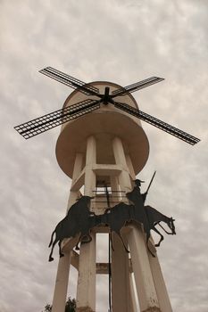 Water tank shaped like a windmill and Quixote picture in Alborea, Castilla la Mancha, Spain