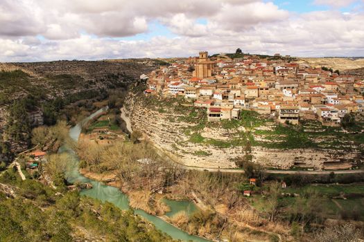 Panoramic of the village of Jorquera on the mountain and the river Cabriel surrounding it. Jorquera, Castilla la Mancha, Spain.