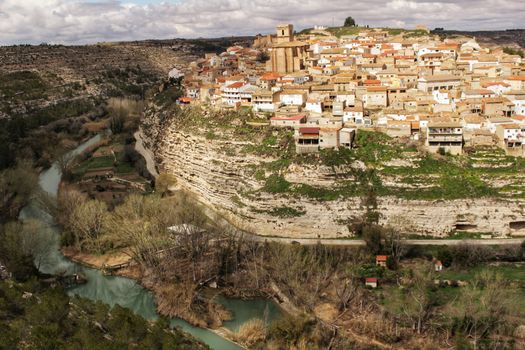 Panoramic of the village of Jorquera on the mountain and the river Cabriel surrounding it. Jorquera, Castilla la Mancha, Spain.