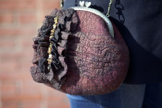 brown Elegant Felting wool fashion handmade handbag in hand. street fashion look