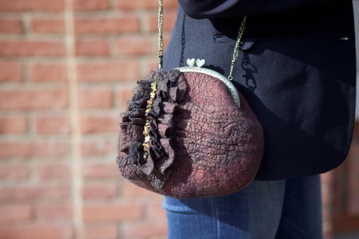 brown Elegant Felting wool fashion handmade handbag in hand. street fashion look