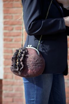 brown Elegant Felting wool fashion handmade handbag in hand. street fashion look