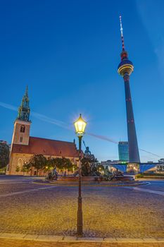 The Alexanderplatz in Berlin with the Marienirche and the Television Tower at dawn