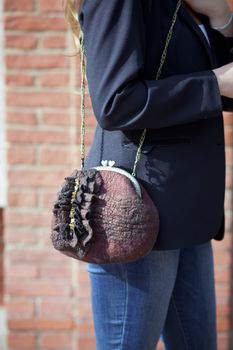 brown Elegant Felting wool fashion handmade handbag in hand. street fashion look