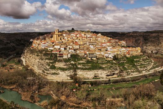 Panoramic of the village of Jorquera on the mountain and the river Cabriel surrounding it. Jorquera, Castilla la Mancha, Spain.