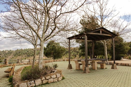 Picnic with chairs and stone table in a mountain viewpoint in Castilla La Mancha, Spain