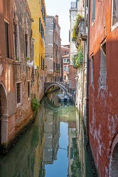Small canal in the old town of Venice, Italy