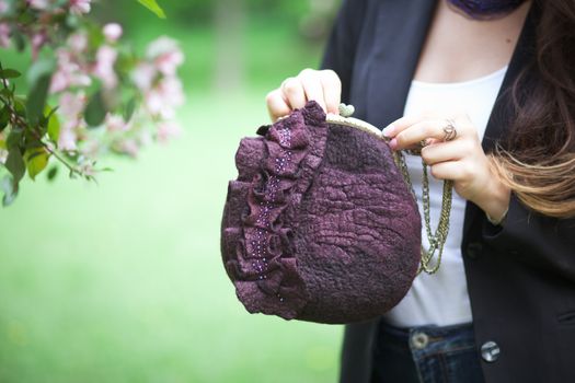 purple Elegant Felting wool fashion handmade handbag in hand. street fashion look