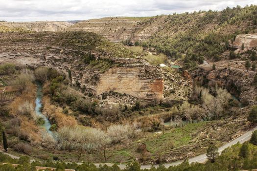 The River Jucar between vegetation and mountain landscape