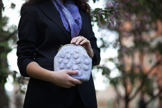 gray Elegant Felting wool fashion handmade handbag in hand. street fashion look