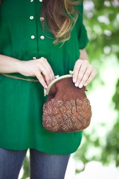 brown Elegant Felting wool fashion handmade handbag in hand. street fashion look