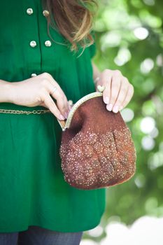 brown Elegant Felting wool fashion handmade handbag in hand. street fashion look