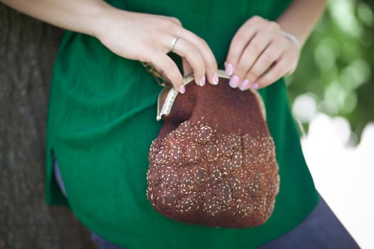 brown Elegant Felting wool fashion handmade handbag in hand. street fashion look