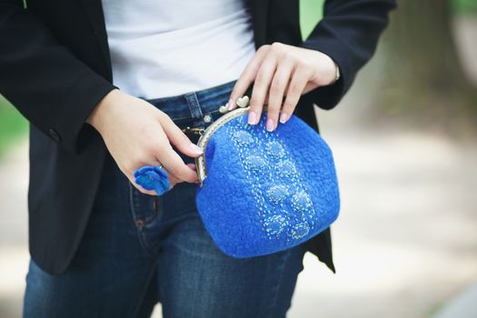 blue Elegant Felting wool fashion handmade handbag in hand. street fashion look