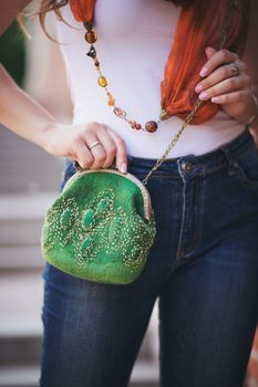 green Elegant Felting wool fashion handmade handbag in hand. street fashion look