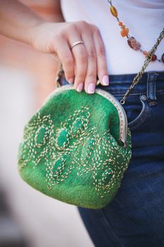 green Elegant Felting wool fashion handmade handbag in hand. street fashion look