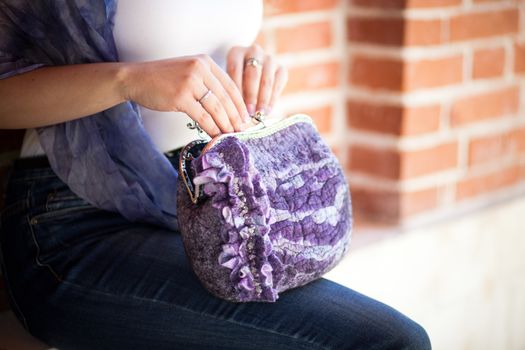 purple Elegant Felting wool fashion handmade handbag in hand. street fashion look